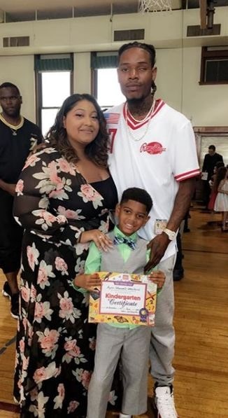 A picture of Aydin Maxwell with his parents.